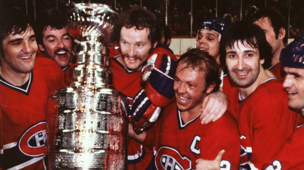 Members of the Montreal Canadiens gather around the Stanley Cup after defeating the Boston Bruins, May 25, 1978 at the Boston Garden. Left to right are: Serge Savard, Yvon Lambert, Larry Robinson, Yvan Cournoyer, Guy Lapointe and Jacques Lemaire. Partially hidden are Pierre Larouche and Ken Dryden. (CP)