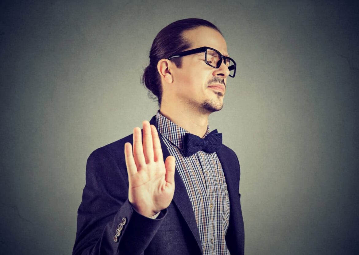man gives stopping gesture